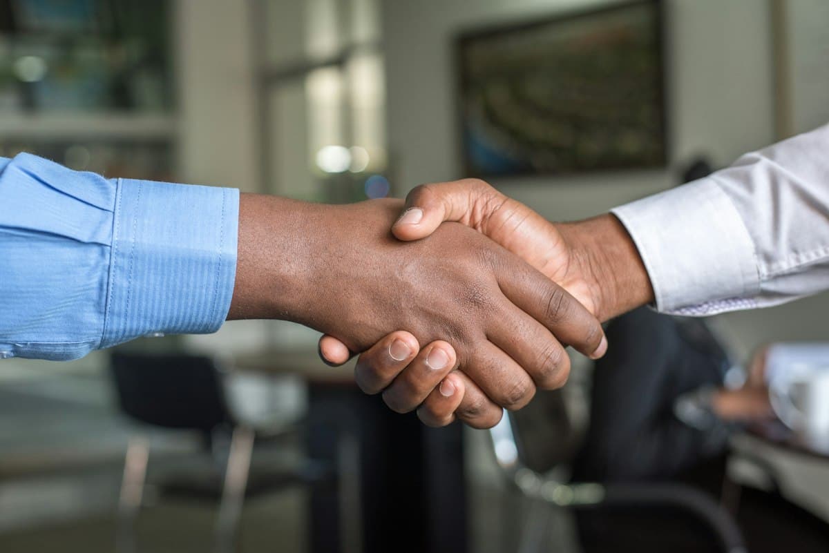 Professionals shaking hands after a business meeting