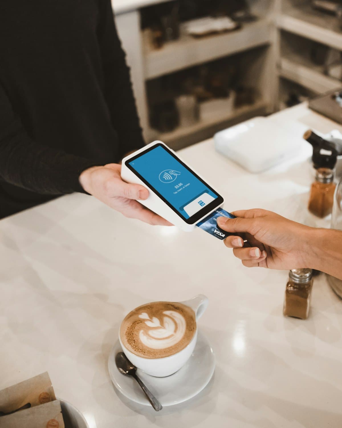 Paying with a rewards card at a local business